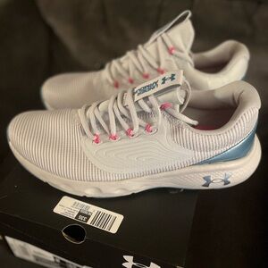 Under Armor Tennis shoes , brand new in box 11 but feel 10’s run slightly sml